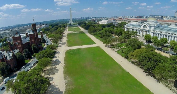 Overhead view of the National Mall, with Smithsonians lining the greenspace and the Washington Monument visible in the distance