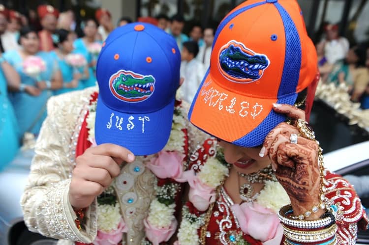 a married couple show off their Florida Gator-themed 