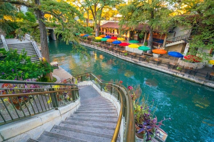 The San Antonio Riverwalk with stairs leading down to it.