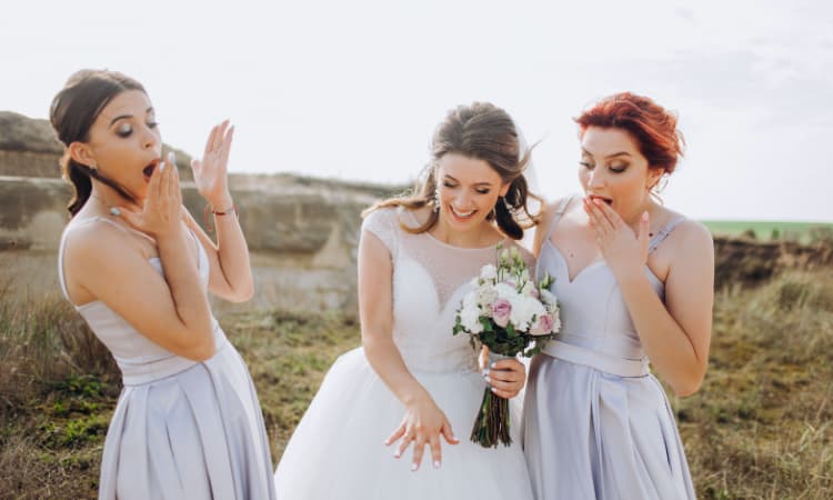 a bride and bridesmaids laughing
