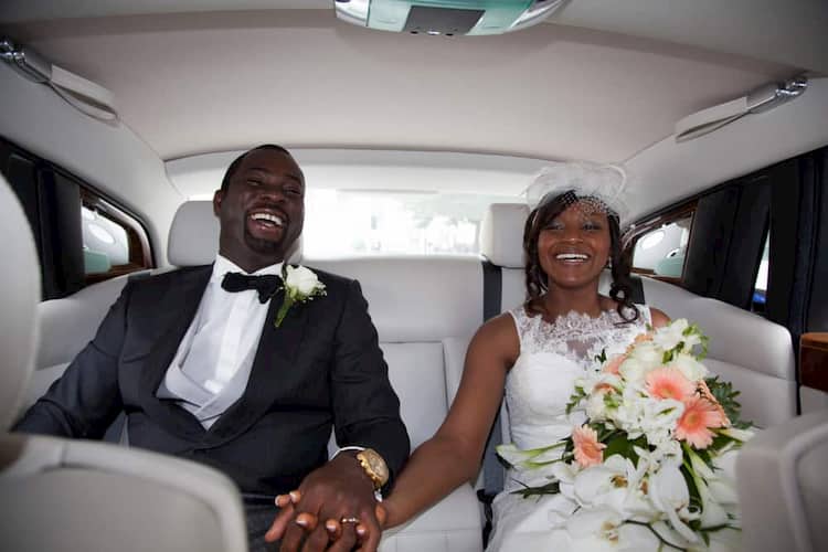 Recently married couple in back of limo