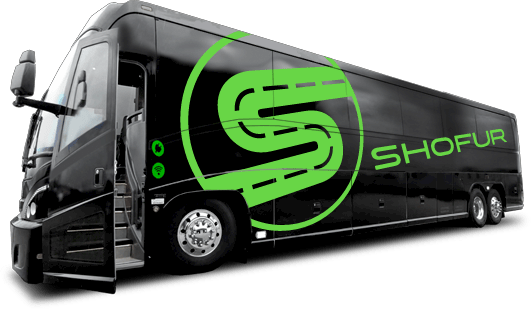a black shofur bus with a green 